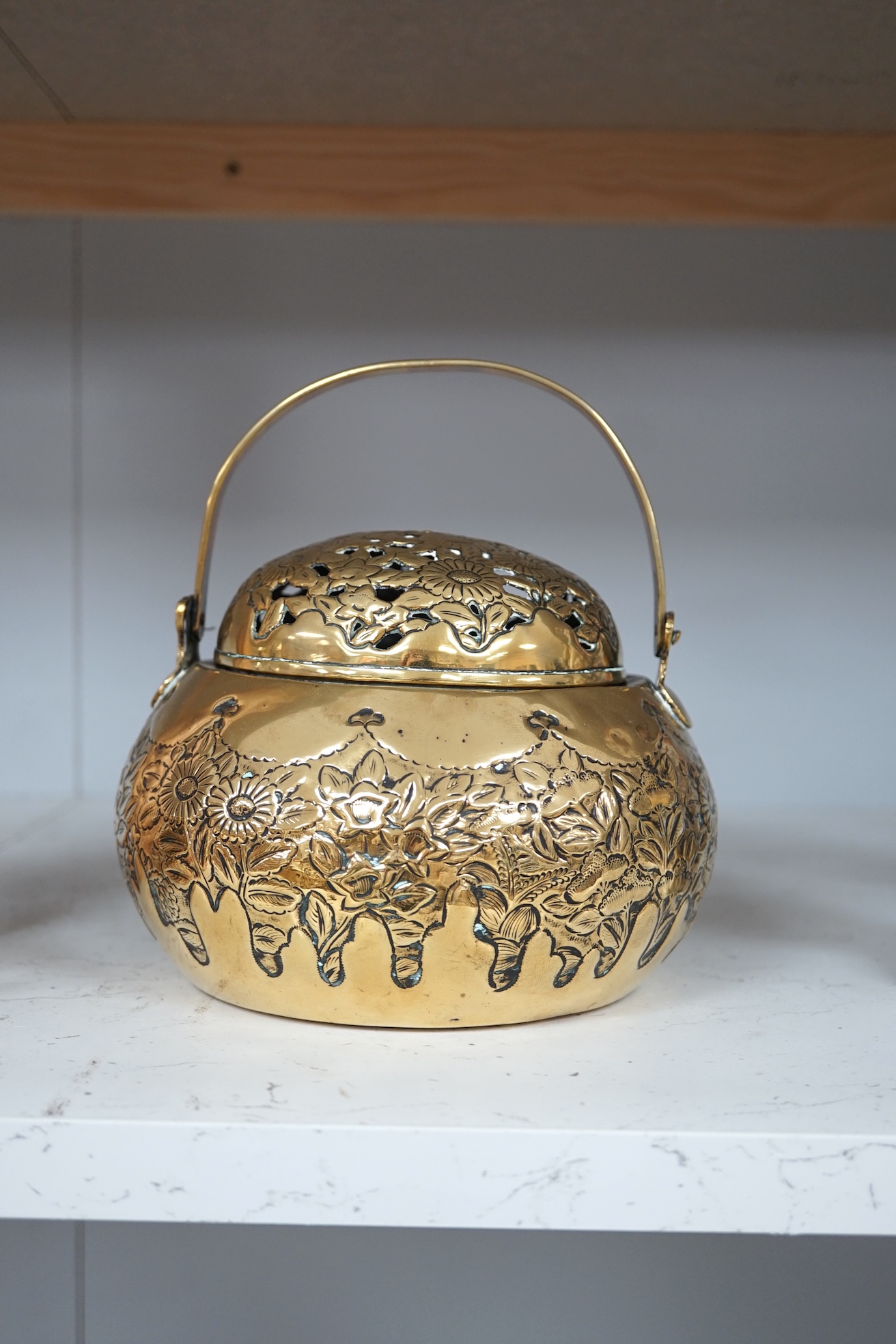 A Chinese brass basket censer and cover, 13cm high. Condition - fair.